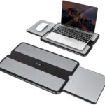 EHO Laptop Lap Pad in black and gray, shown with a laptop on a bed, with the retractable mouse pad extended.