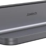 Spacegrey aluminum vertical laptop stand holding a MacBook Pro, showcasing its sleek design and desktop organization.