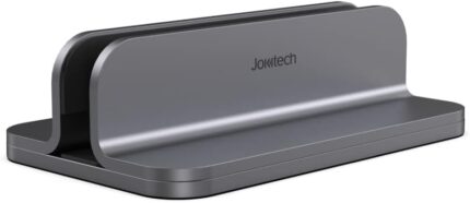 Spacegrey aluminum vertical laptop stand holding a MacBook Pro, showcasing its sleek design and desktop organization.
