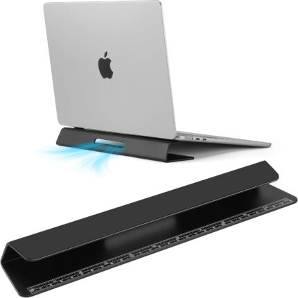 Black Psitek portable laptop cooling stand, made of aluminum, shown elevating a laptop on a desk surface.