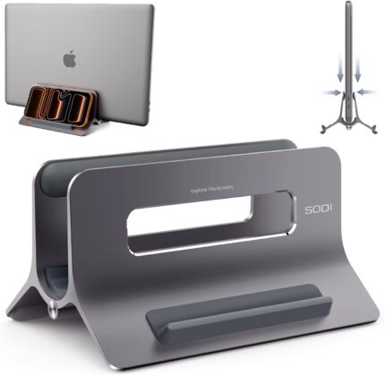 A space gray SODI vertical laptop stand holding a MacBook in an upright position on a clean desk.